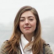 headshot of white woman with long brown hair